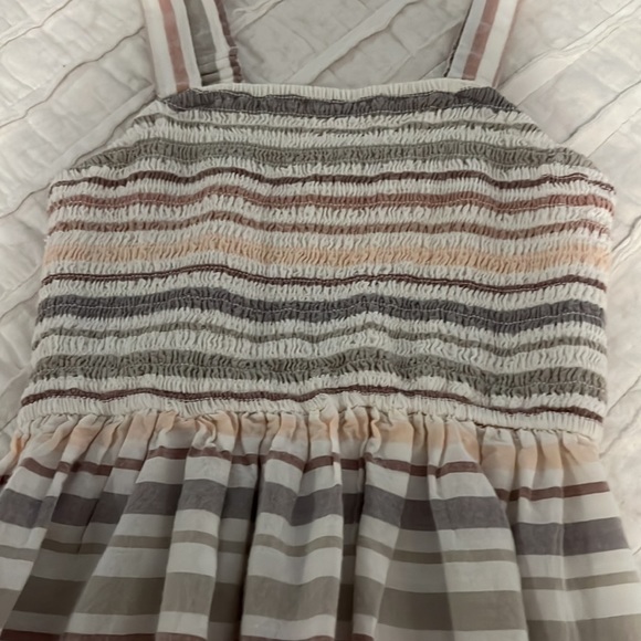 Stripped top. Ribbed material ish and flowy on bottom - Picture 2 of 3